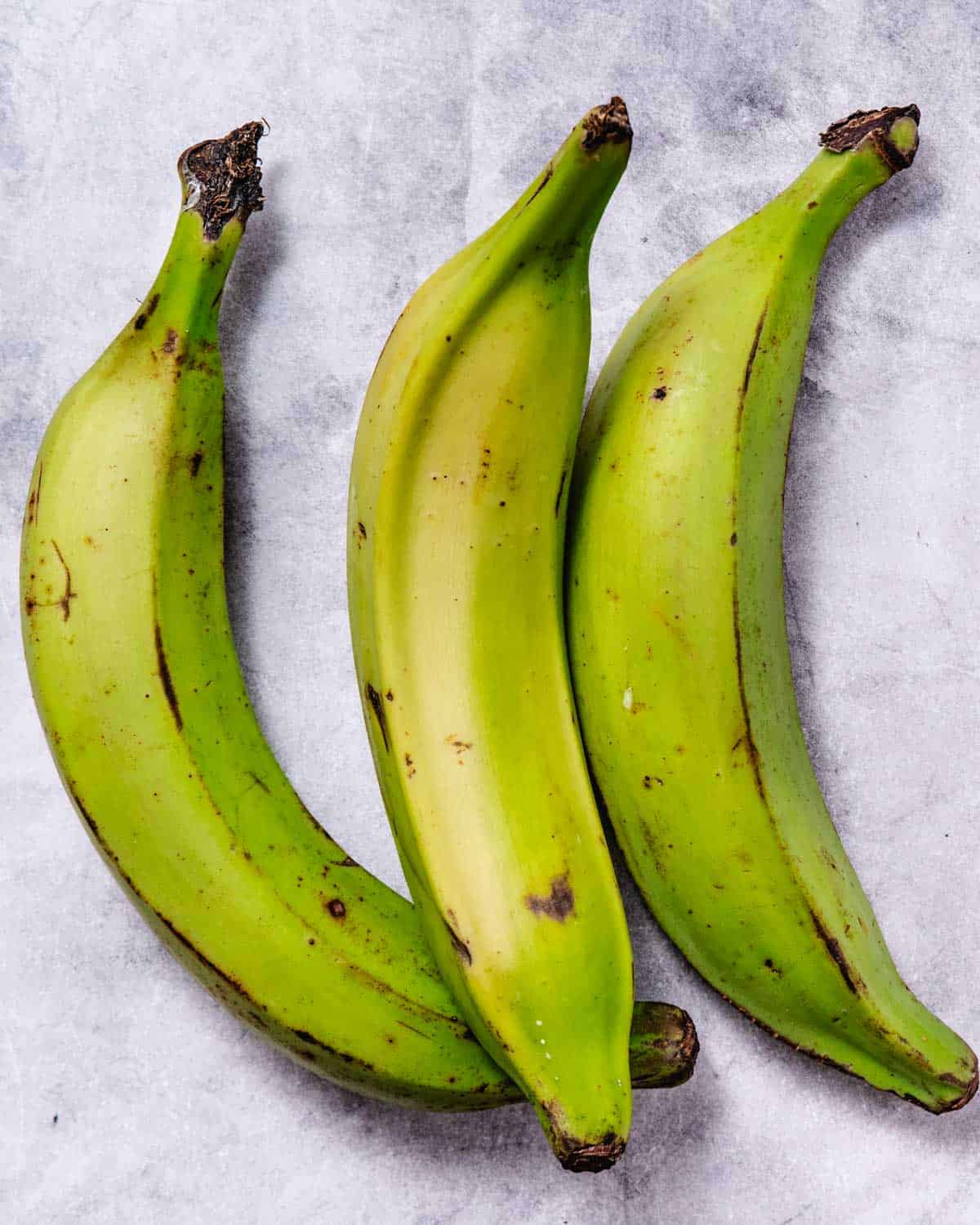 Three green plantains