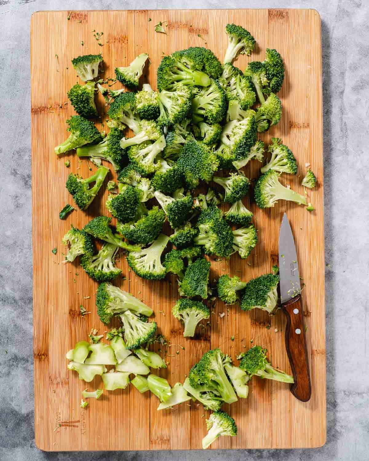 chopping broccoli on cutting board