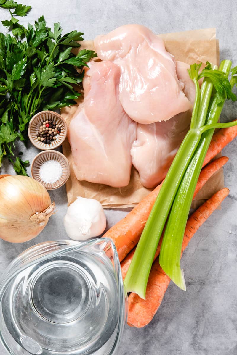 Poached chicken, carrots, celery, parsely, onion, garlic, salt, and pepper.