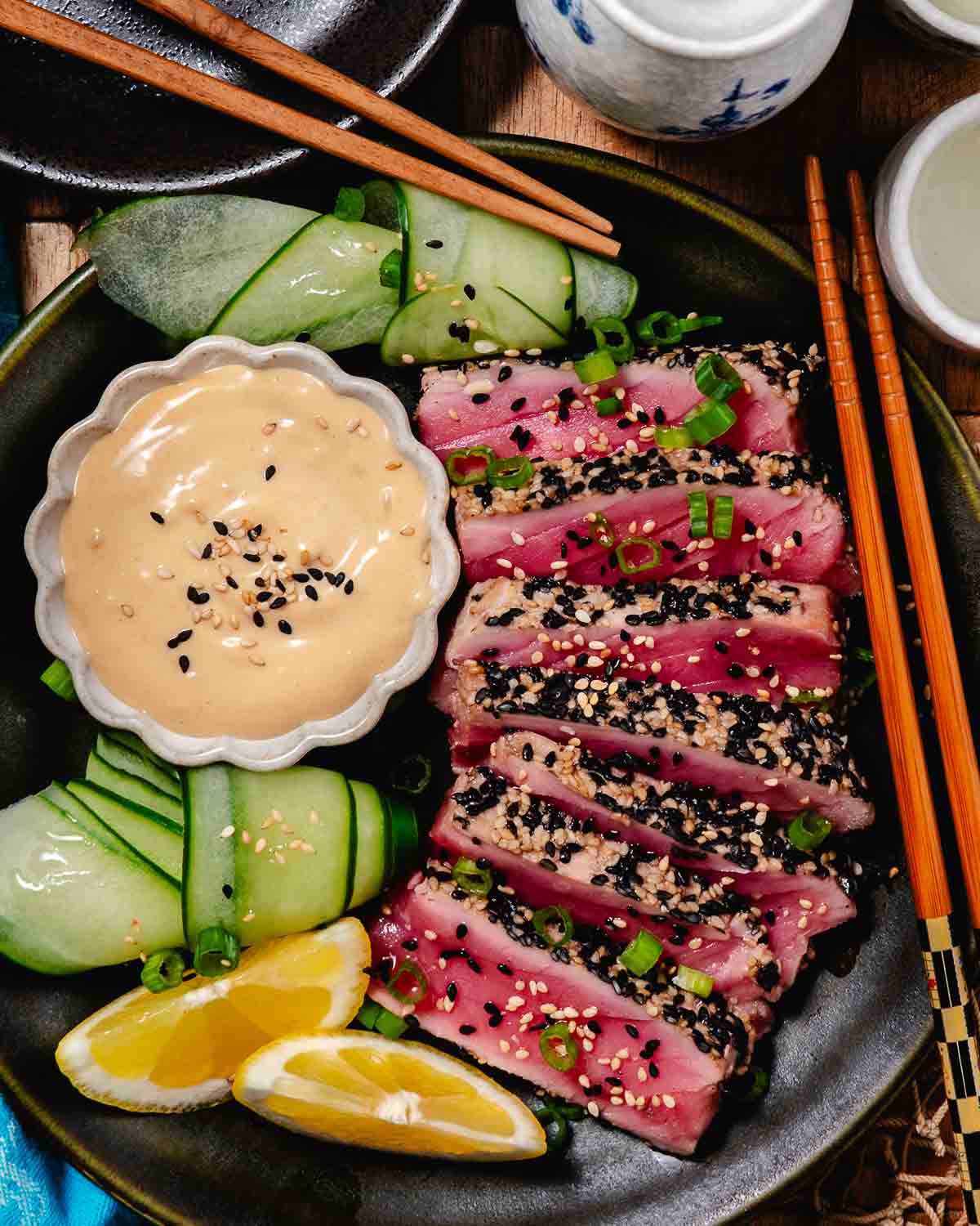 Overhead view of seared yellowfin tuna with sesame dipping sauce.