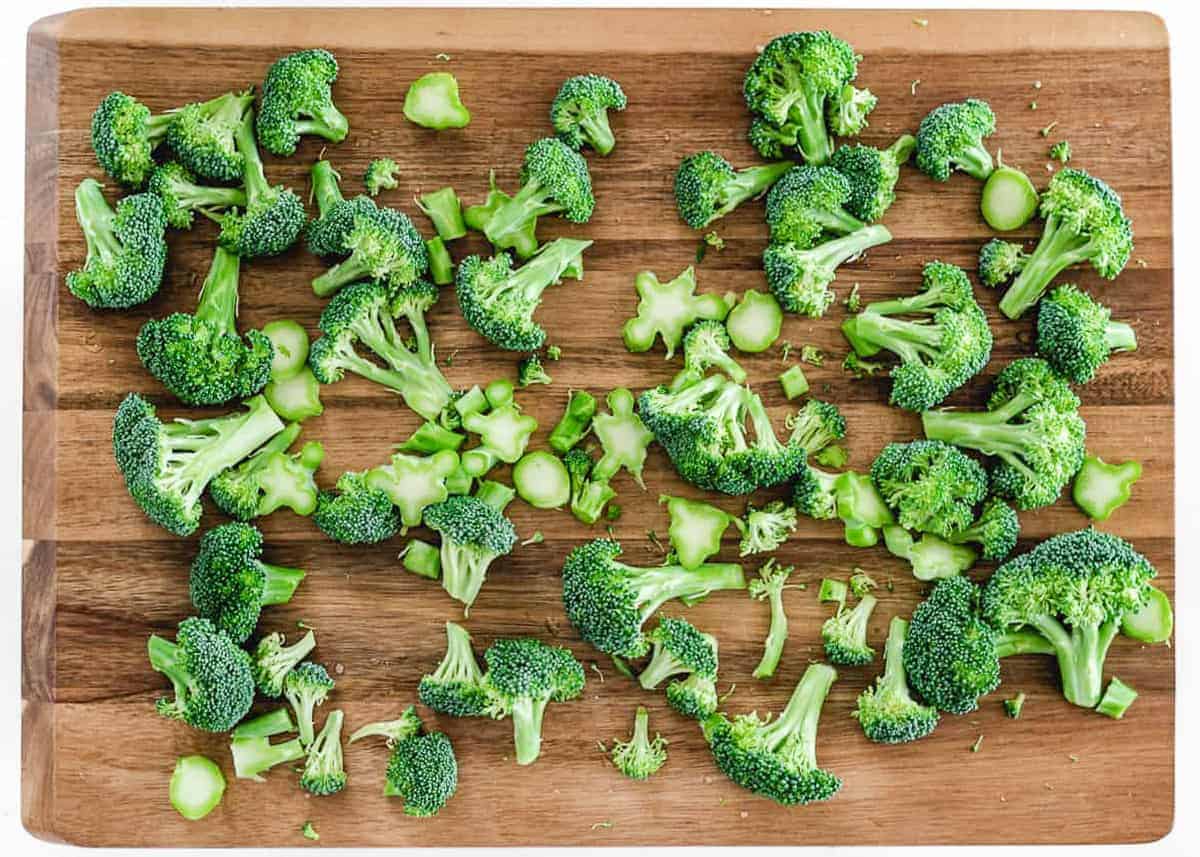 Raw broccoli on a board.