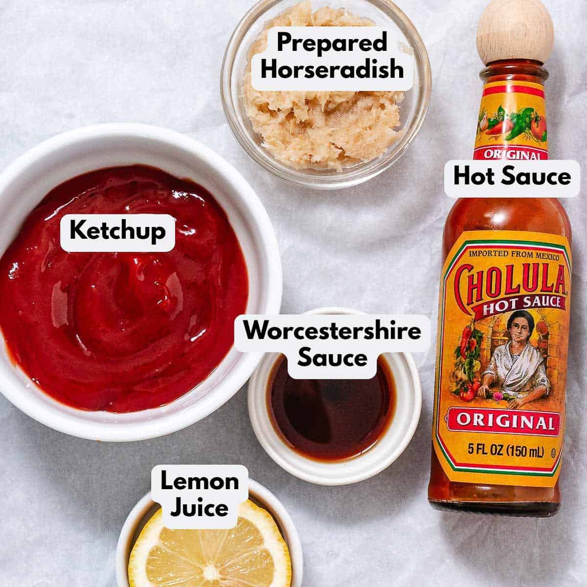 Labeled cocktail sauce ingredients: ketchup, prepared horseradish, Worcestershire sauce, hot sauce, and lemon juice.