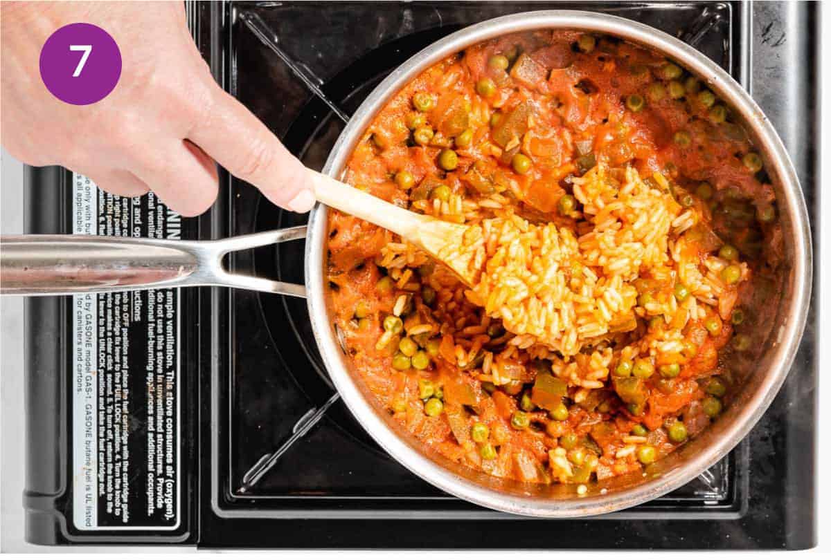 Spanish Rice in a pot on stovetop.