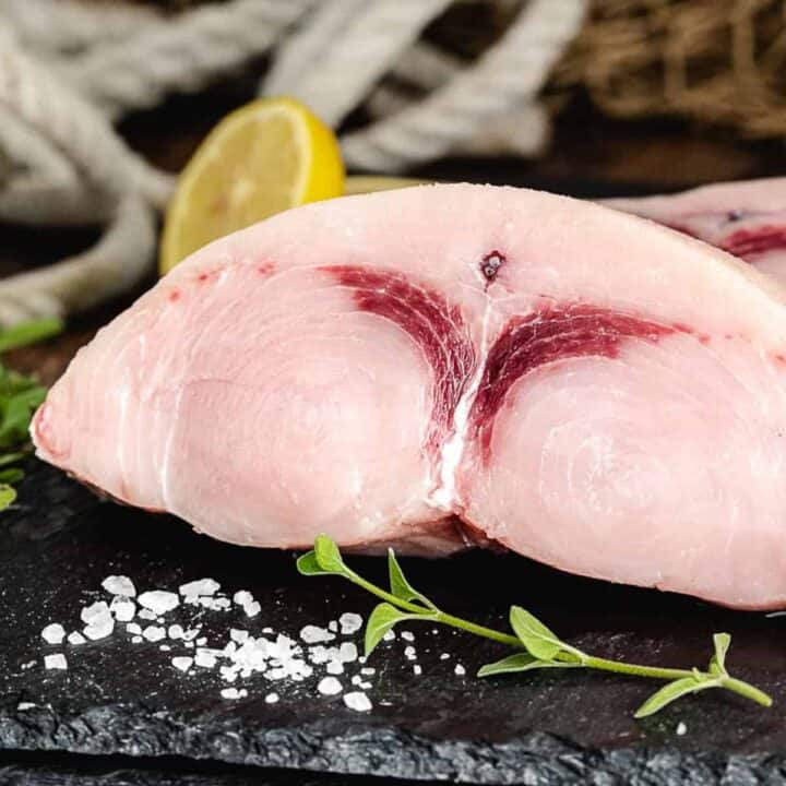 Fresh swordfish steak with lemon.