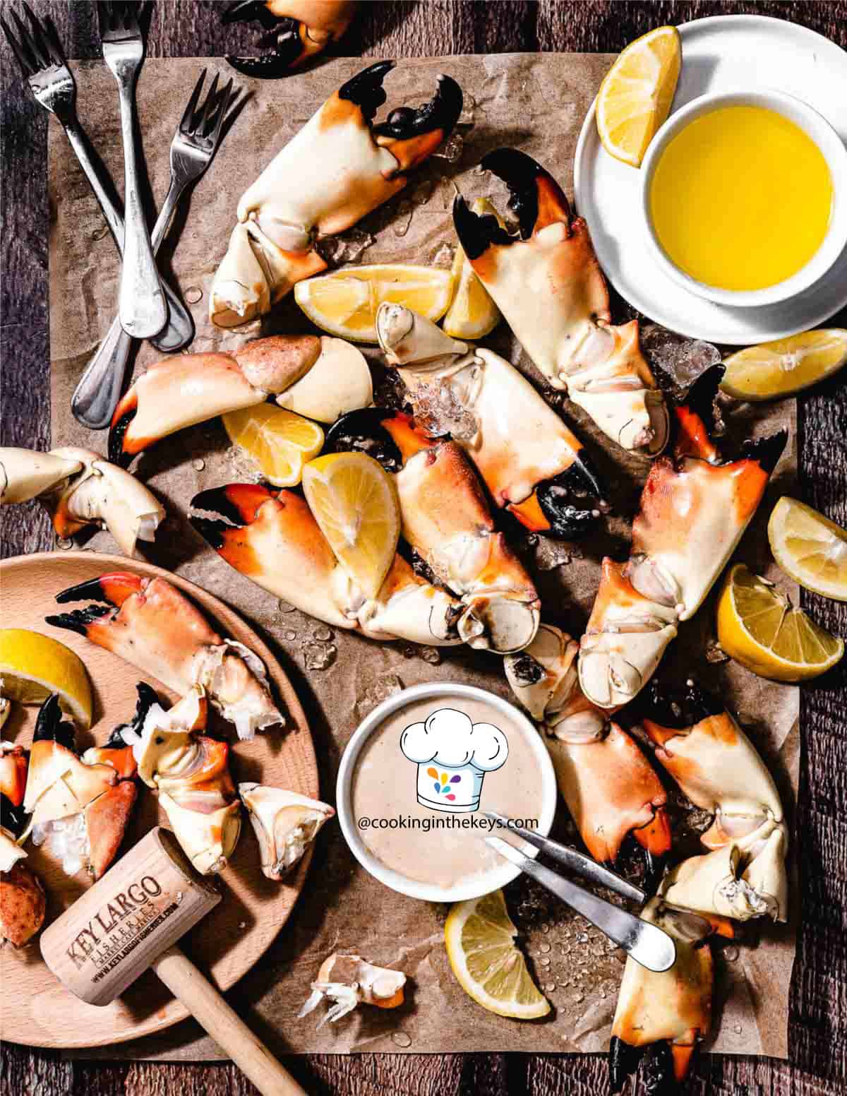 Stone crabs with mustard sauce on a board.