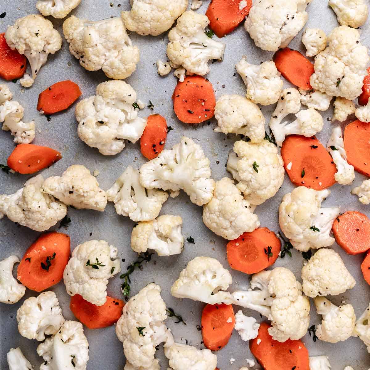 Baking cauliflower and carrots on a sheet pan
