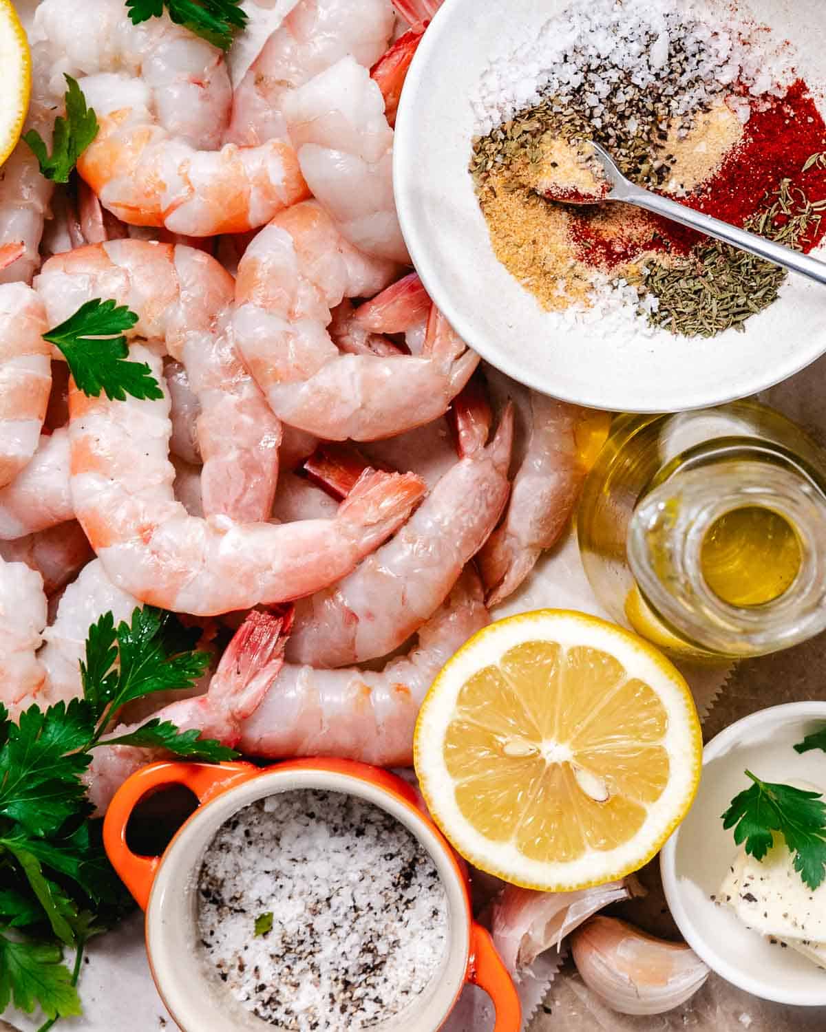 Raw shrimp with Cajun blackened seasoning, lemon, garlic, olive oil, parsley, salt, and pepper.