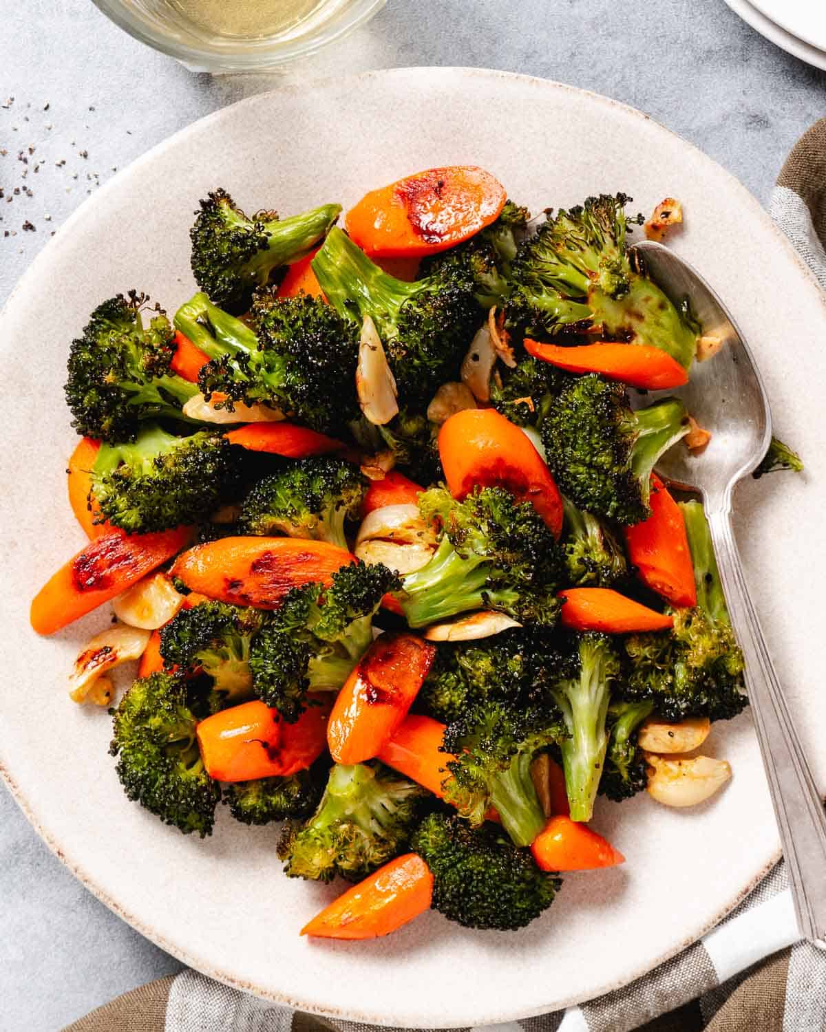 Roasted broccoli and carrots on a plate.