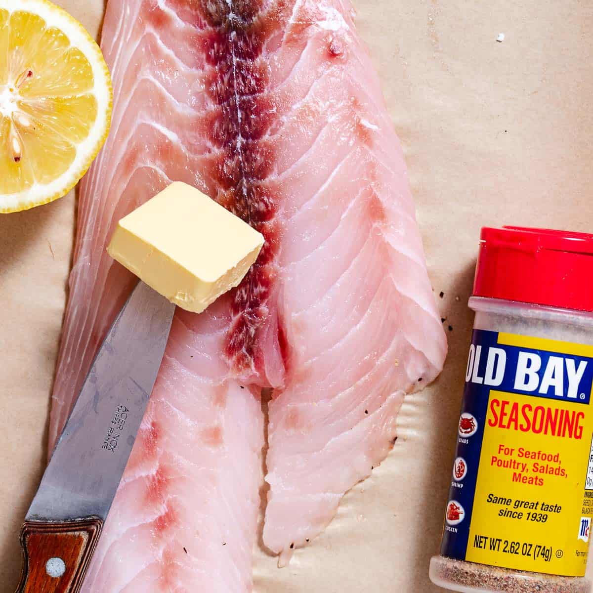 fresh fish fillet with old bay, lemon, and butter