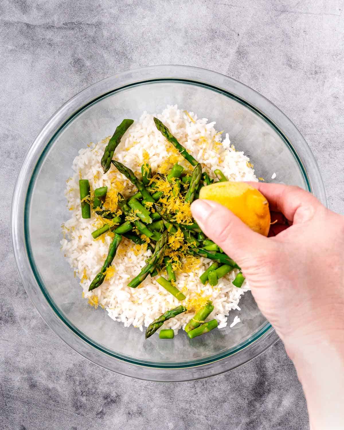 Rice, asparagus, lemon in a bowl.