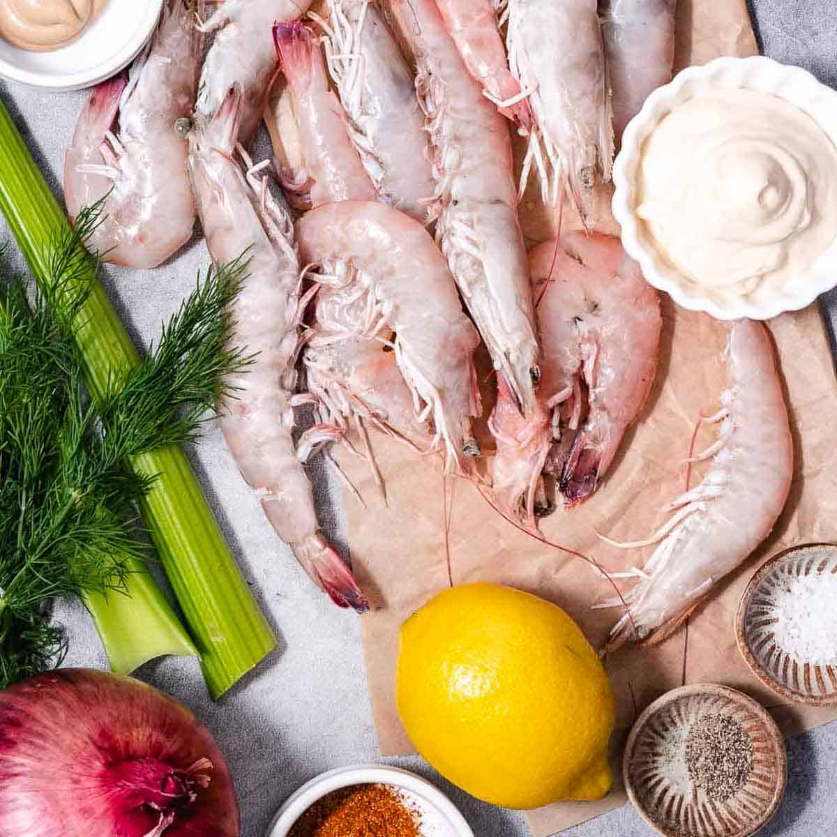 shrimp salad ingredients including shrimp, mayonnaise, old bay and celery.