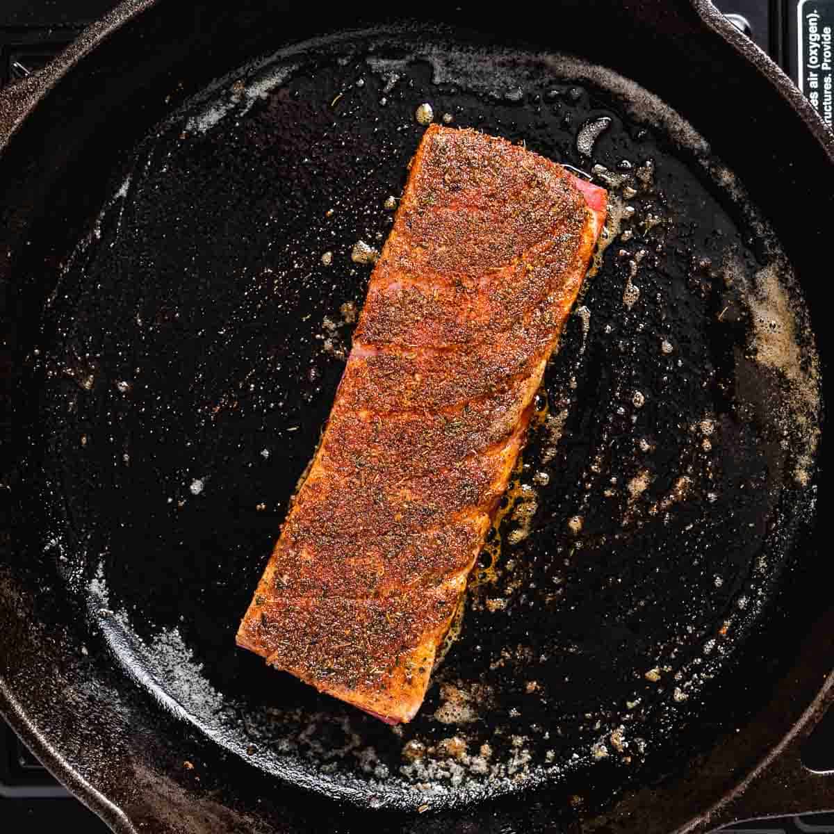 Tuna cooking in cast iron skittle.
