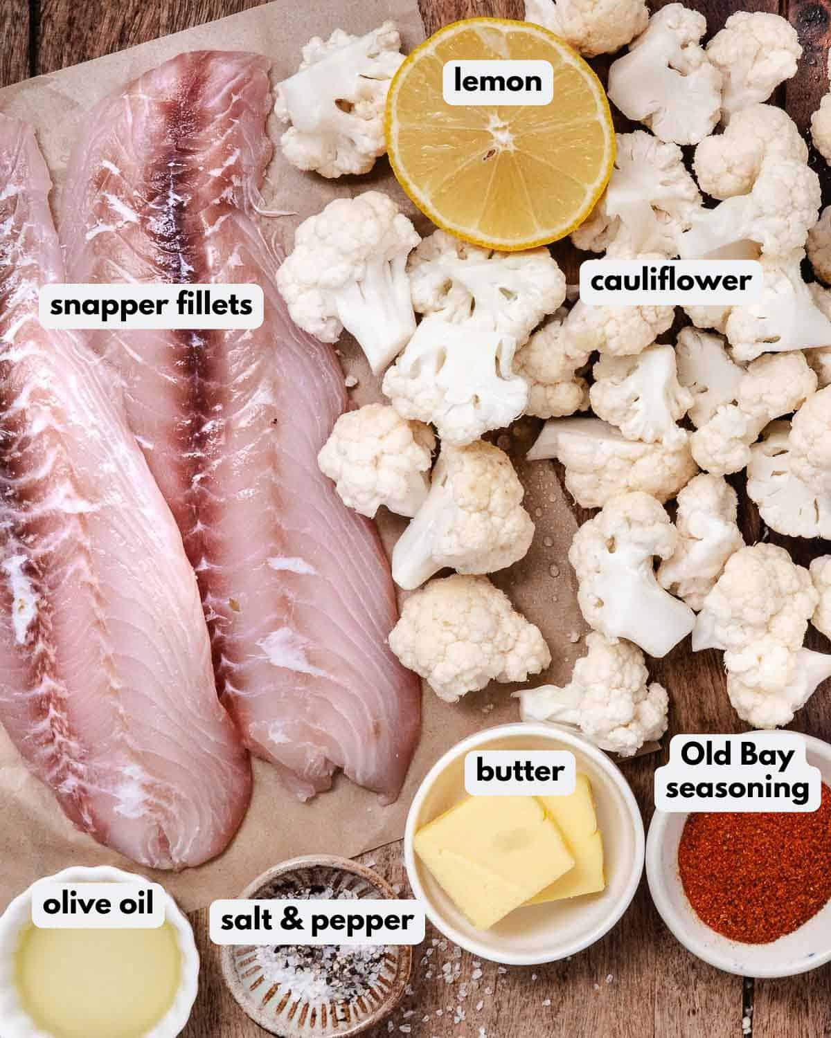 Ingredients for air fryer snapper: snapper fillets, cauliflower, lemon, olive oil, butter, Old Bay, salt, and pepper