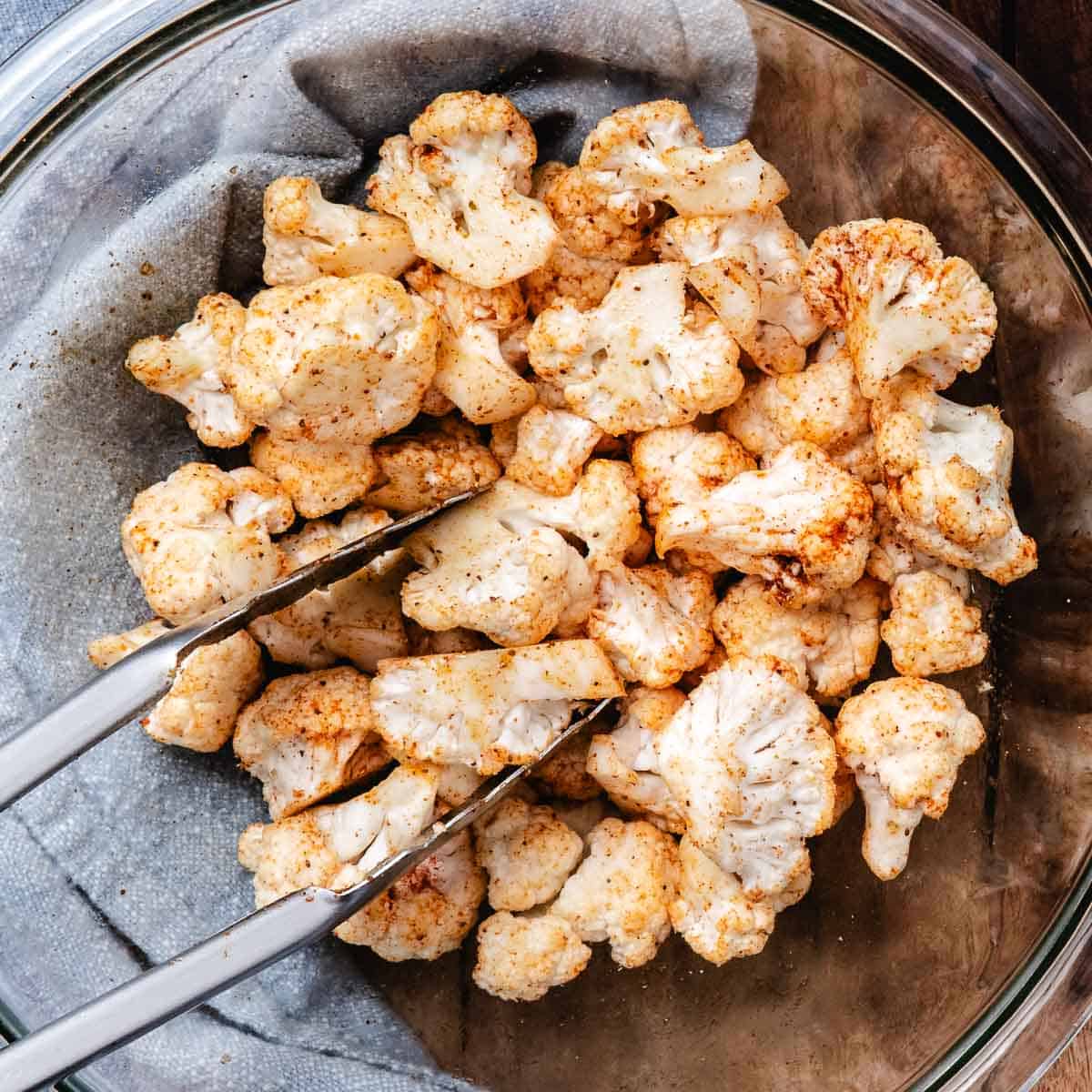 Cauliflower florets tossed with olive oil and Old Bay seasoning