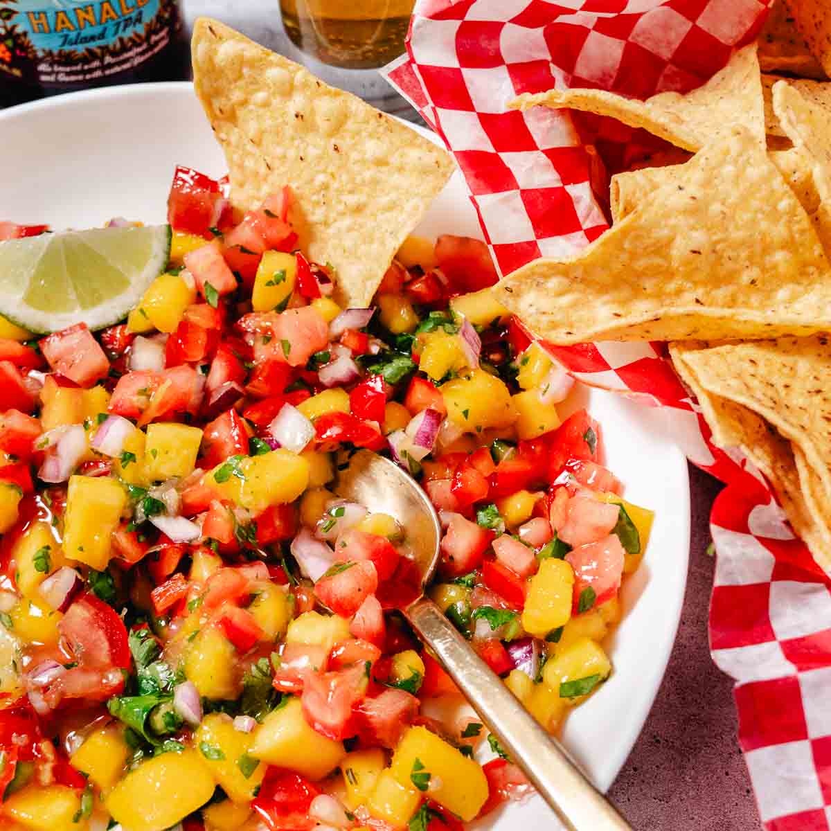 bowl of mango pico de gallo with tortilla chips