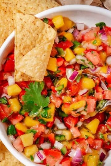 bowl of mango pico de gallo with tortilla chips