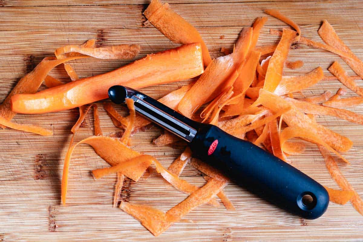 Carrot peeler with carrot shreds.