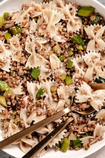 Bowl of buckwheat stuffing with spoons in it.