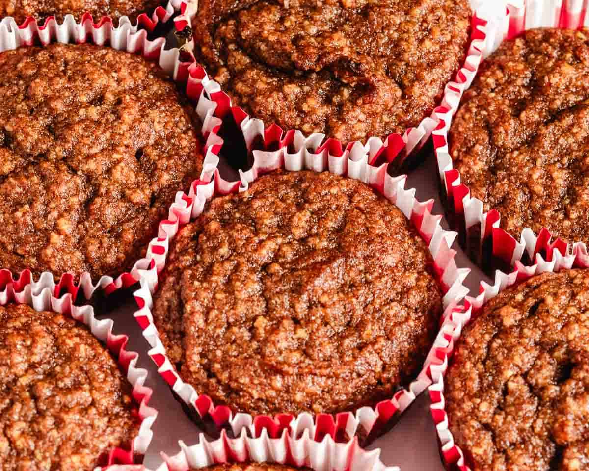 Pumpkin muffins in red and white wrappers.