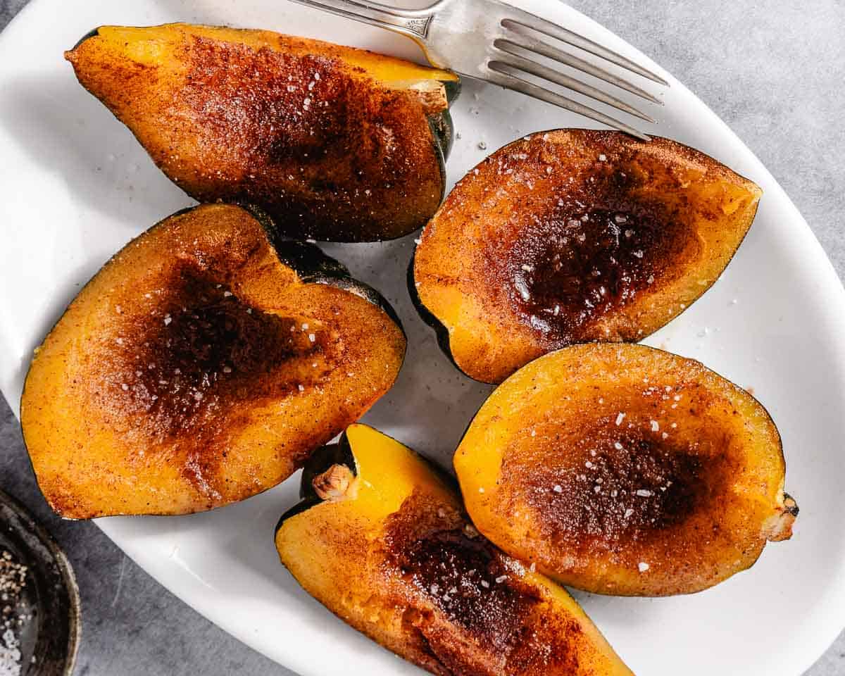 roasted quarters of acorn squash with cinnamon topping.