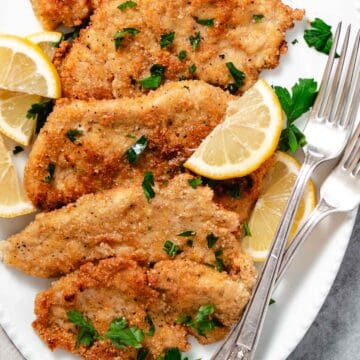 Fried Turkey Cutlets on a white plate.