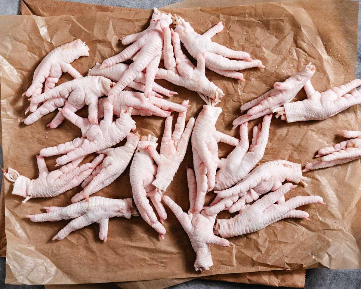 Raw chicken feet prepped for soup.