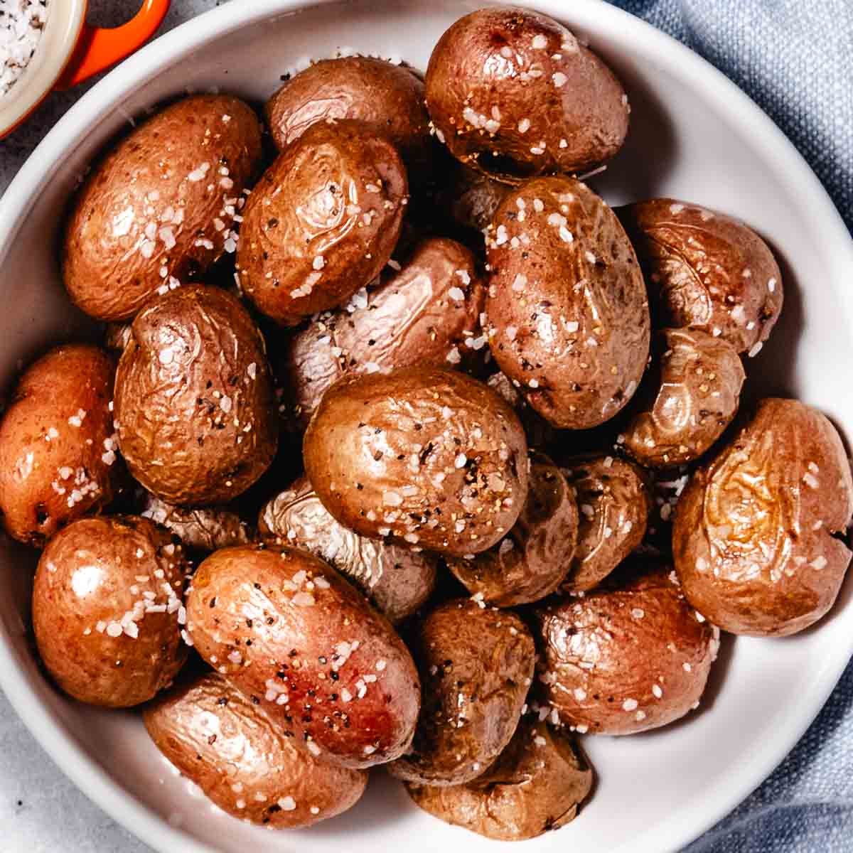Crispy roasted red potatoes in a bowl.