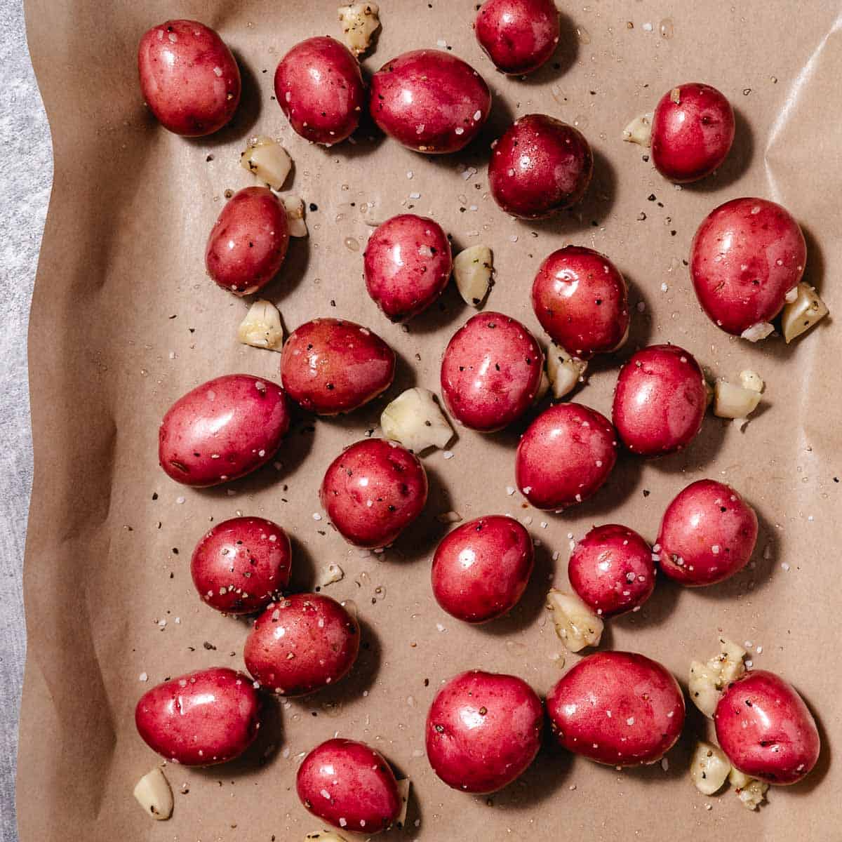 Roasting red potatoes on a sheet pan.