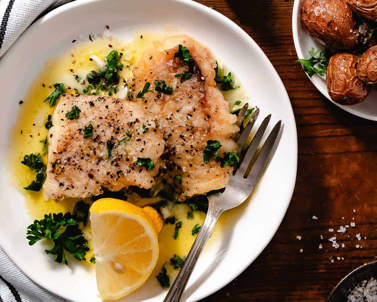 Tripletail fish with potatoes and lemon dinner.