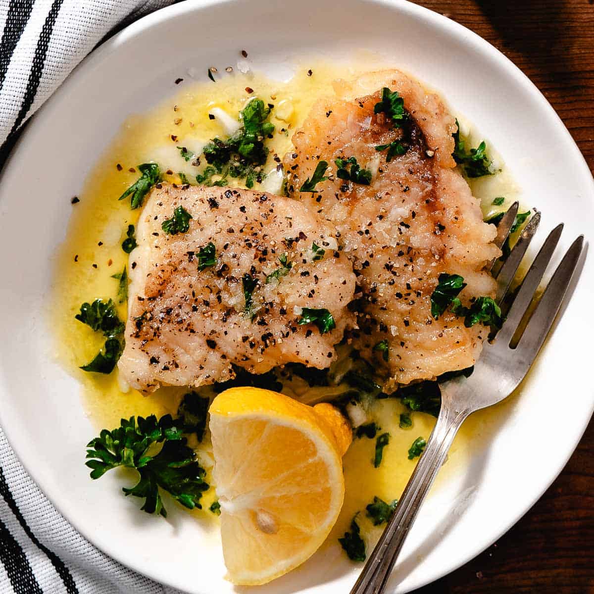 Tripletail with lemon butter sauce.