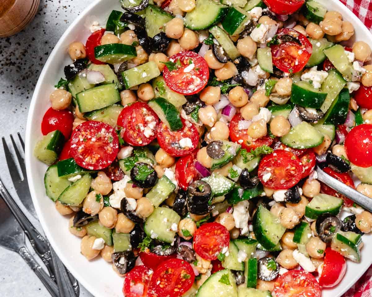 Fresh chickpea cucumber feta salad in a bowl ready to serve.
