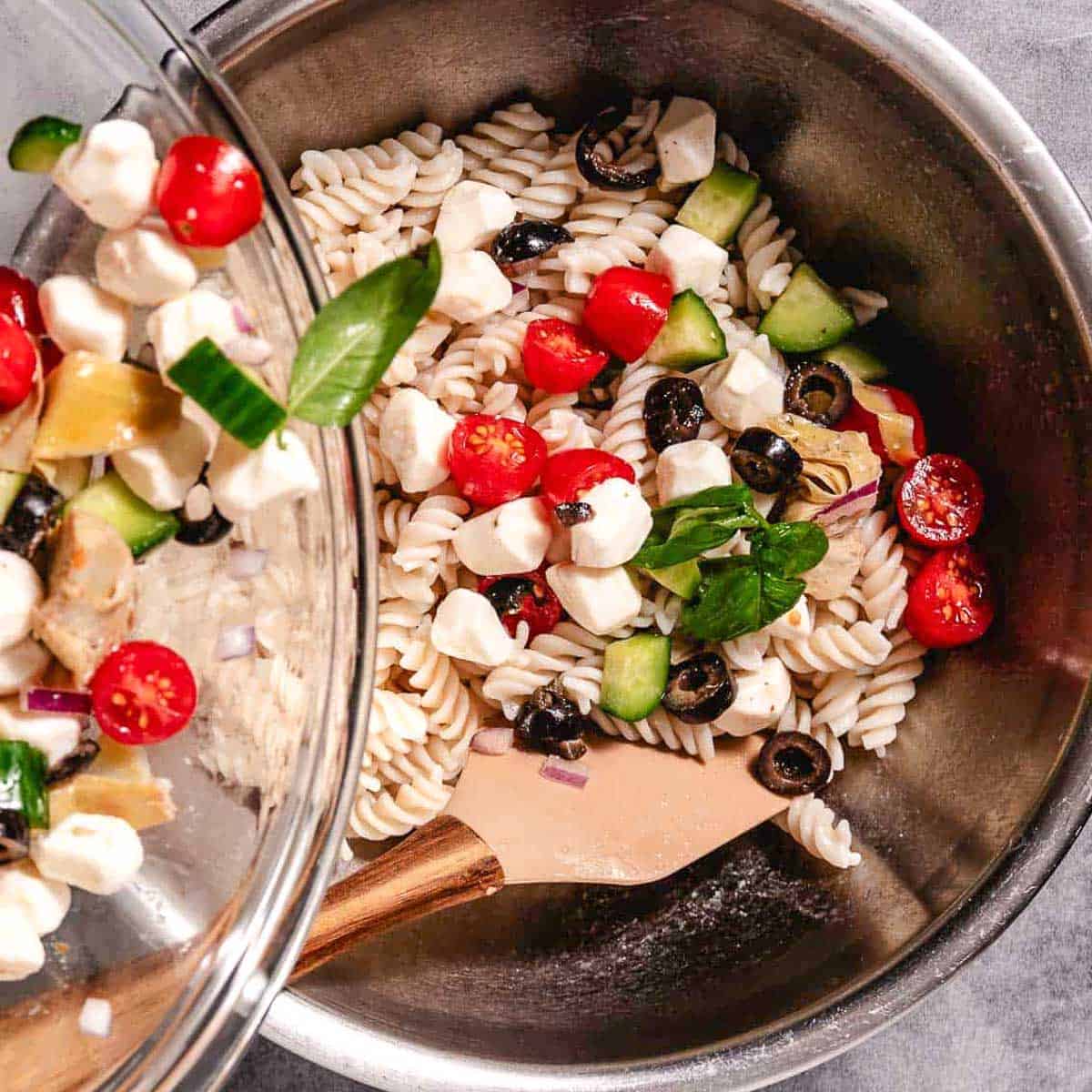 Gluten free pasta with mozzarella, basil, and veggies.