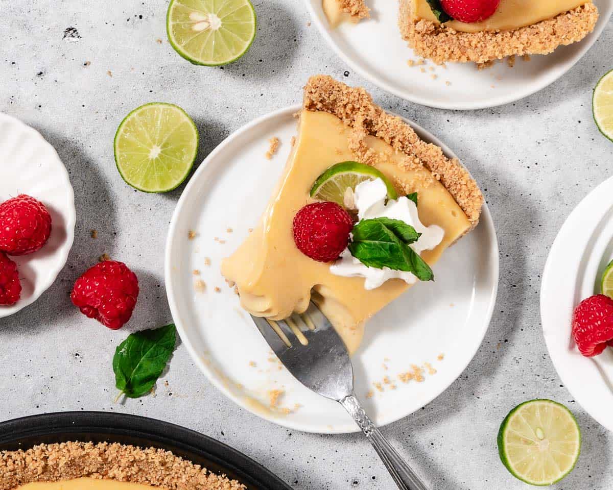 Key lime pie with a raspberry on top.