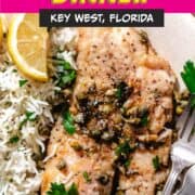 Fish Piccata with lemon and rice on a plate.