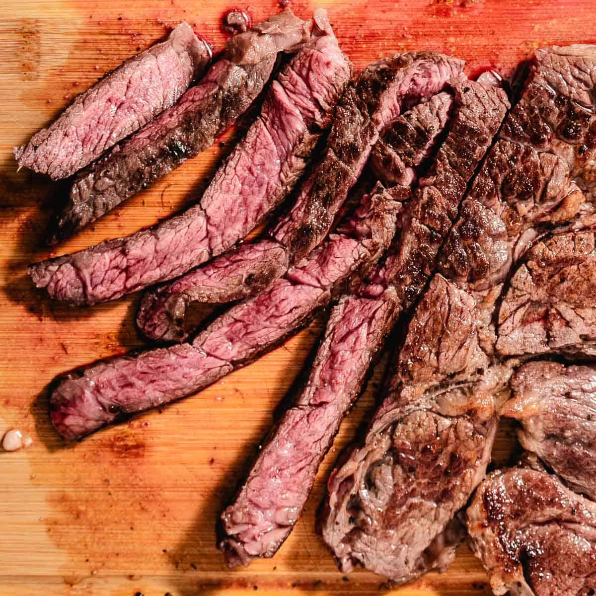 Slices of seared chuck steak.