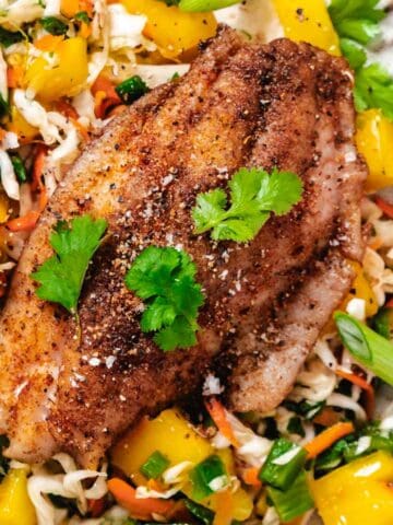 fish with mango and cabbage coleslaw.