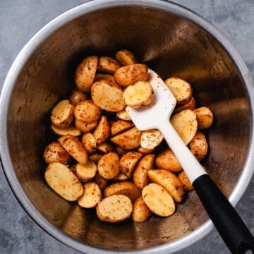 Mixing potatoes in a bowl.