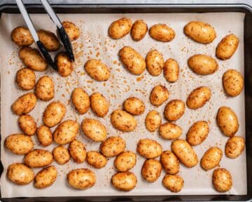 Golden potatoes on a sheet pan.
