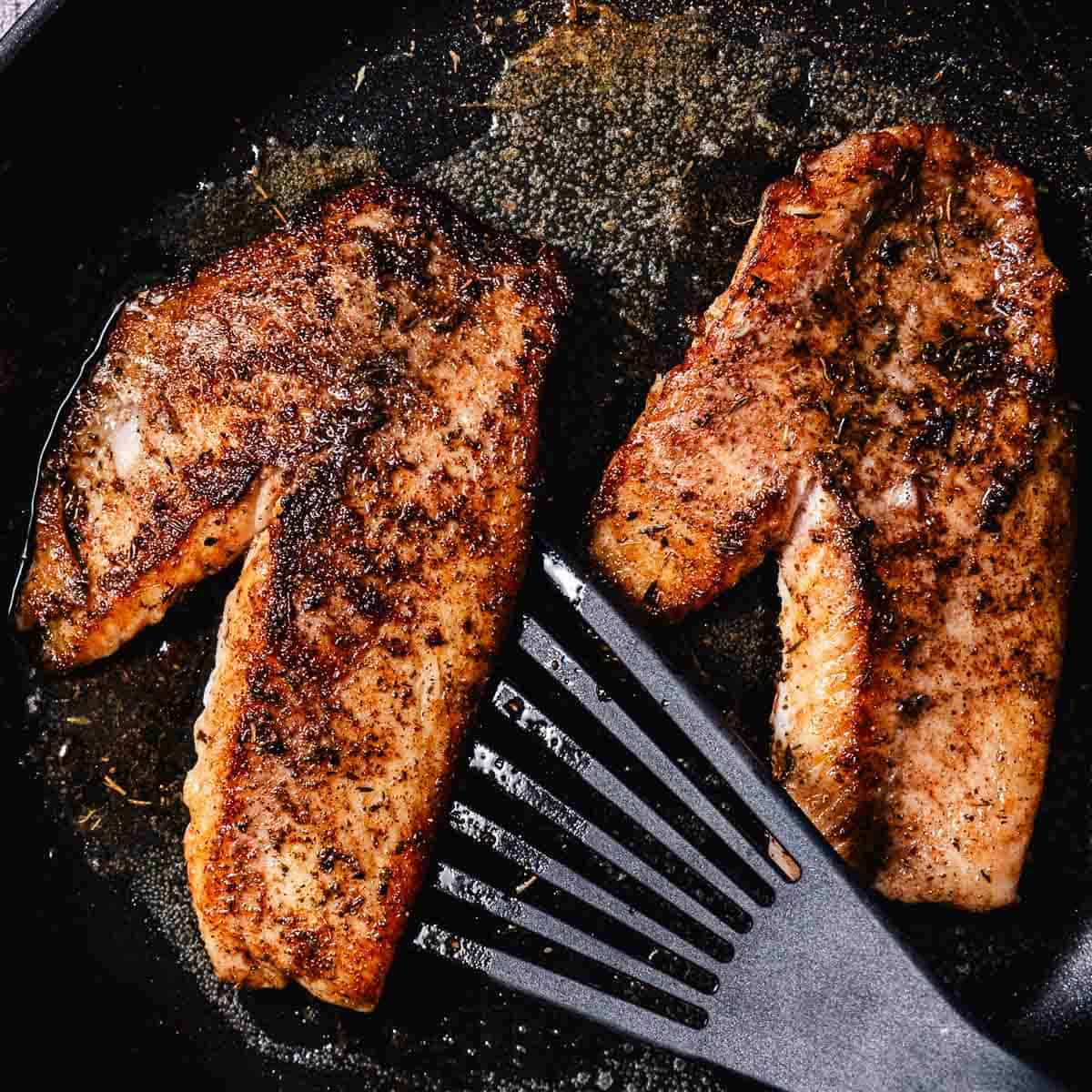 seared snapper in a cast iron skillet