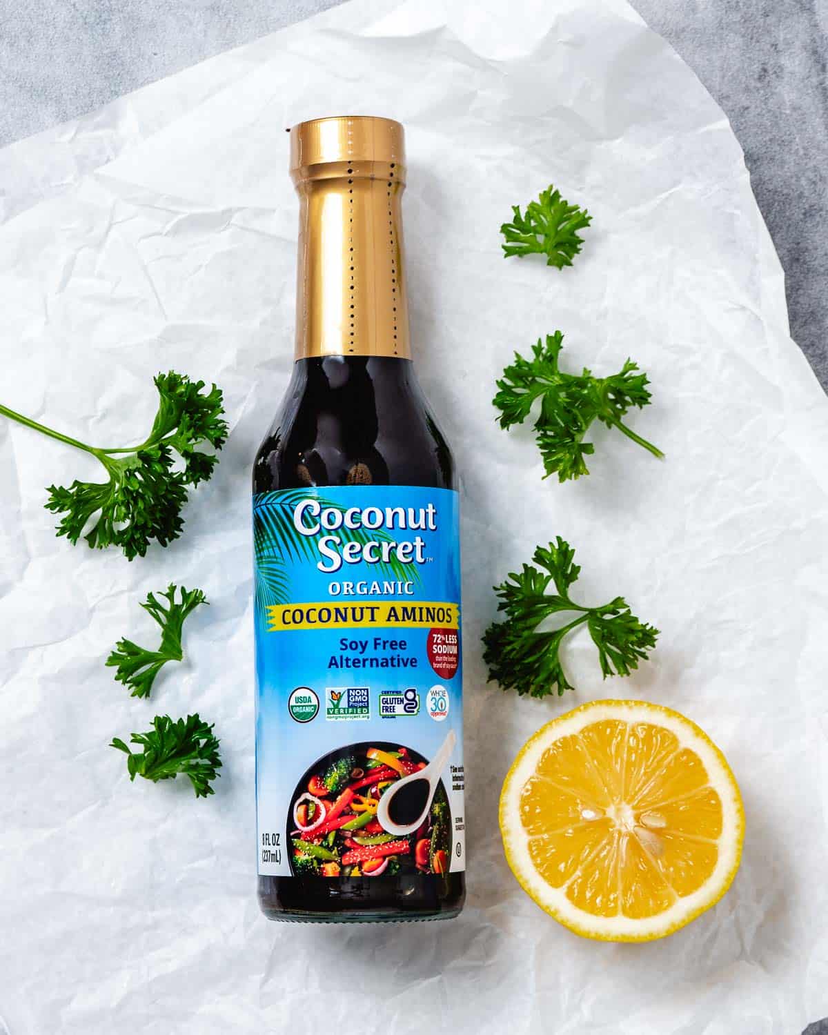 coconut secret coconut aminos with lemon and parsley.