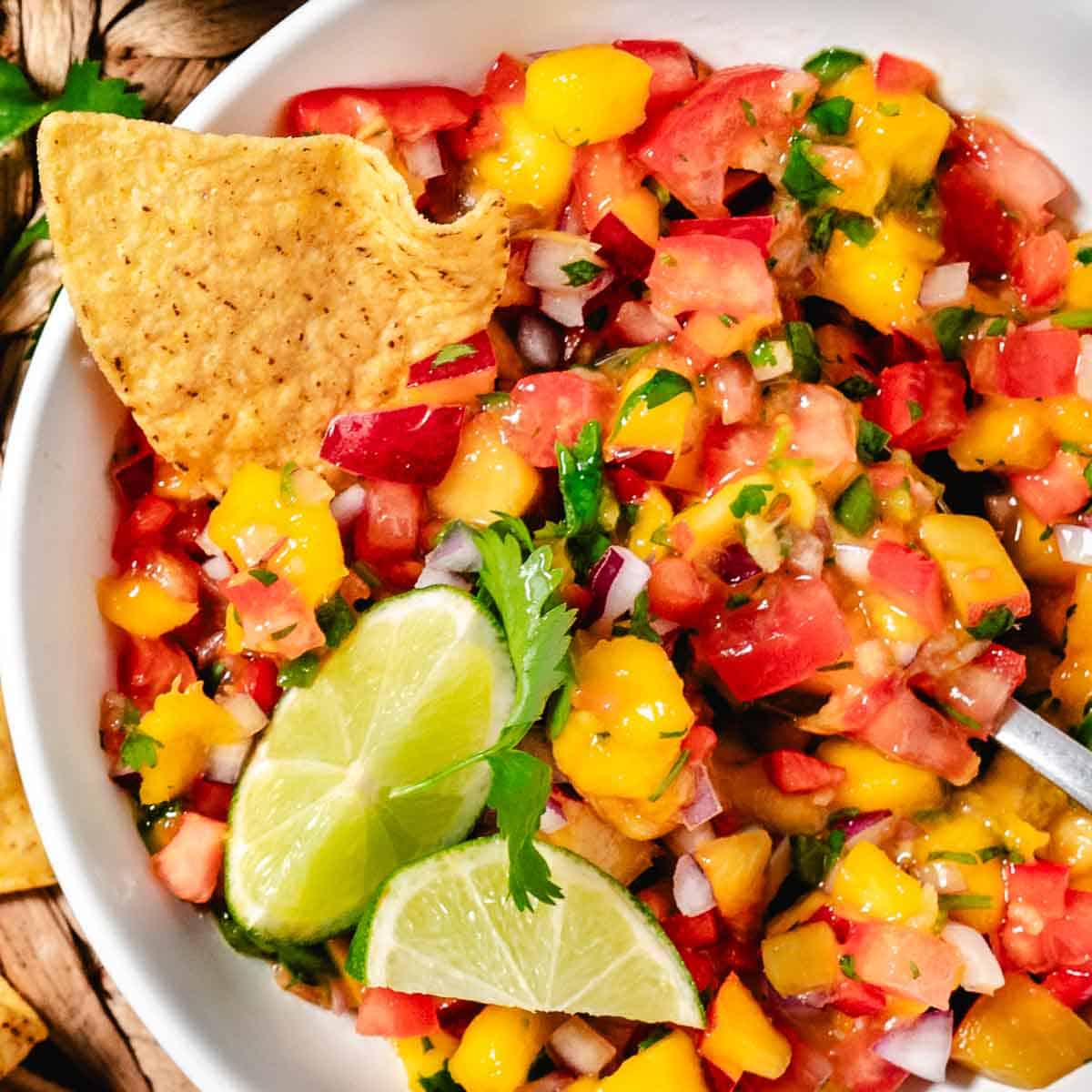 peach mango salsa with lime and tortillas