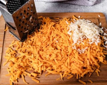 Grated cheese with a box grater.