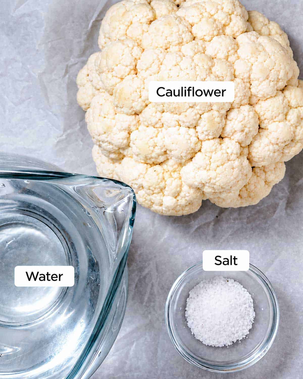 Fresh cauliflower florets, salt, and ice for boiling cauliflower