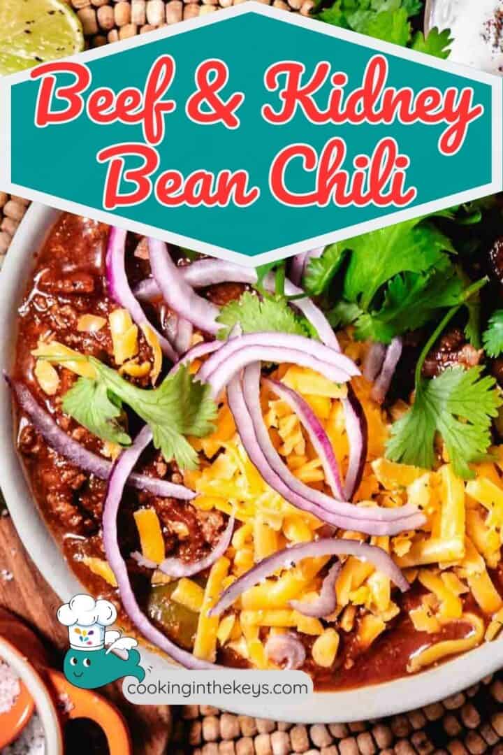 beef and kidney bean chili in a bowl with cheddar