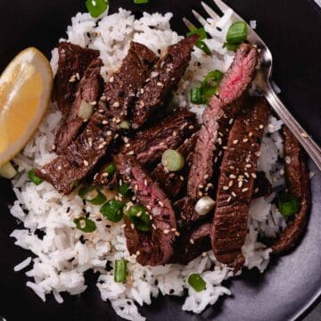 cooked skirt steak with rice and sesame seeds