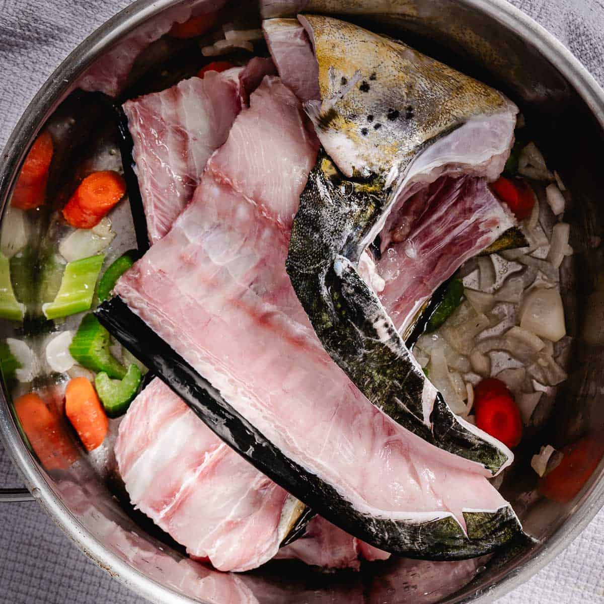 fish bones and chopped carrots and celery for fish stock