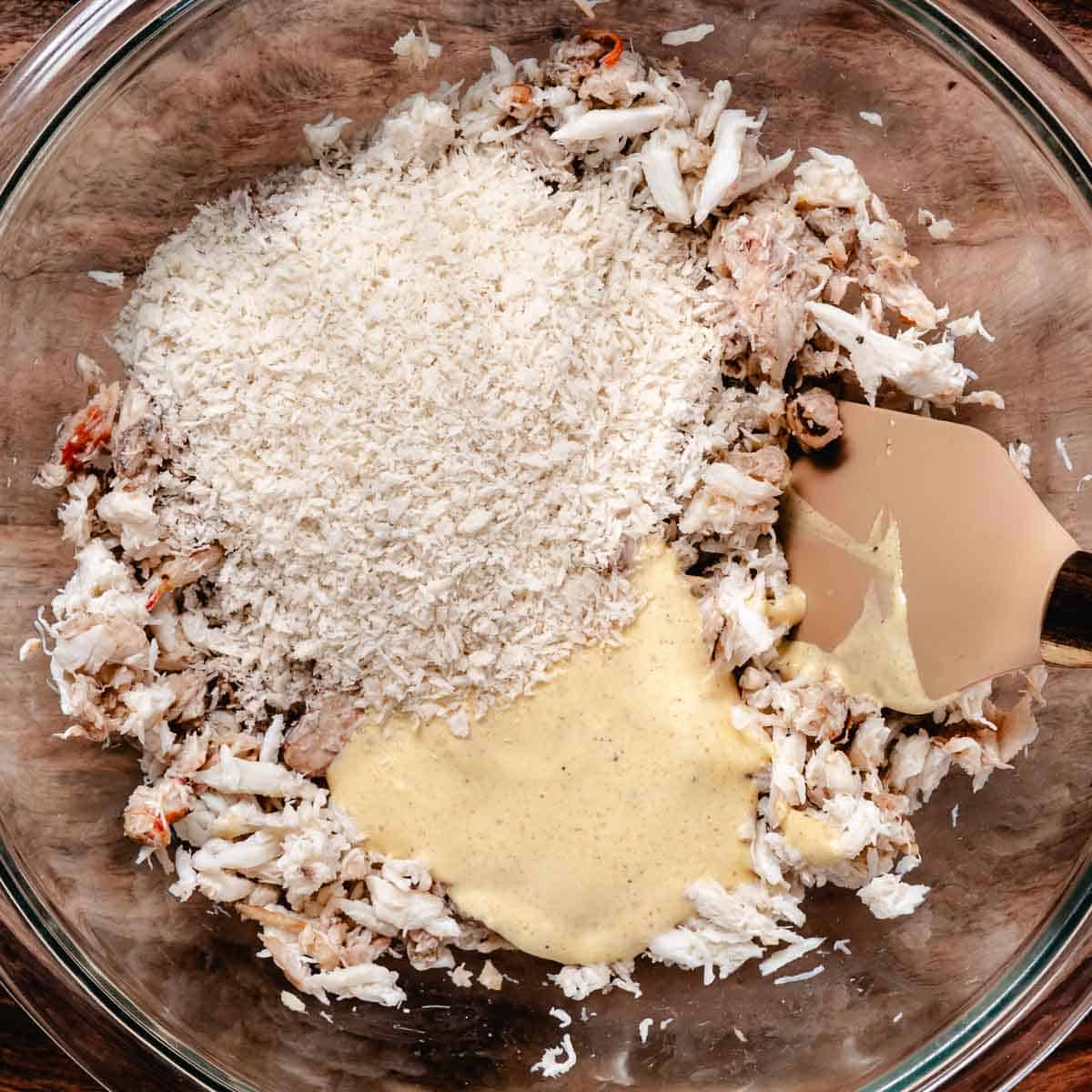 Panko and seasoned mayonnaise mixture added to lump and claw crabmeat.
