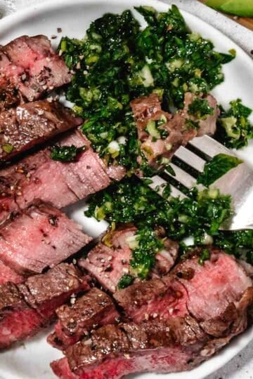 plate of steak smothered with gremolata