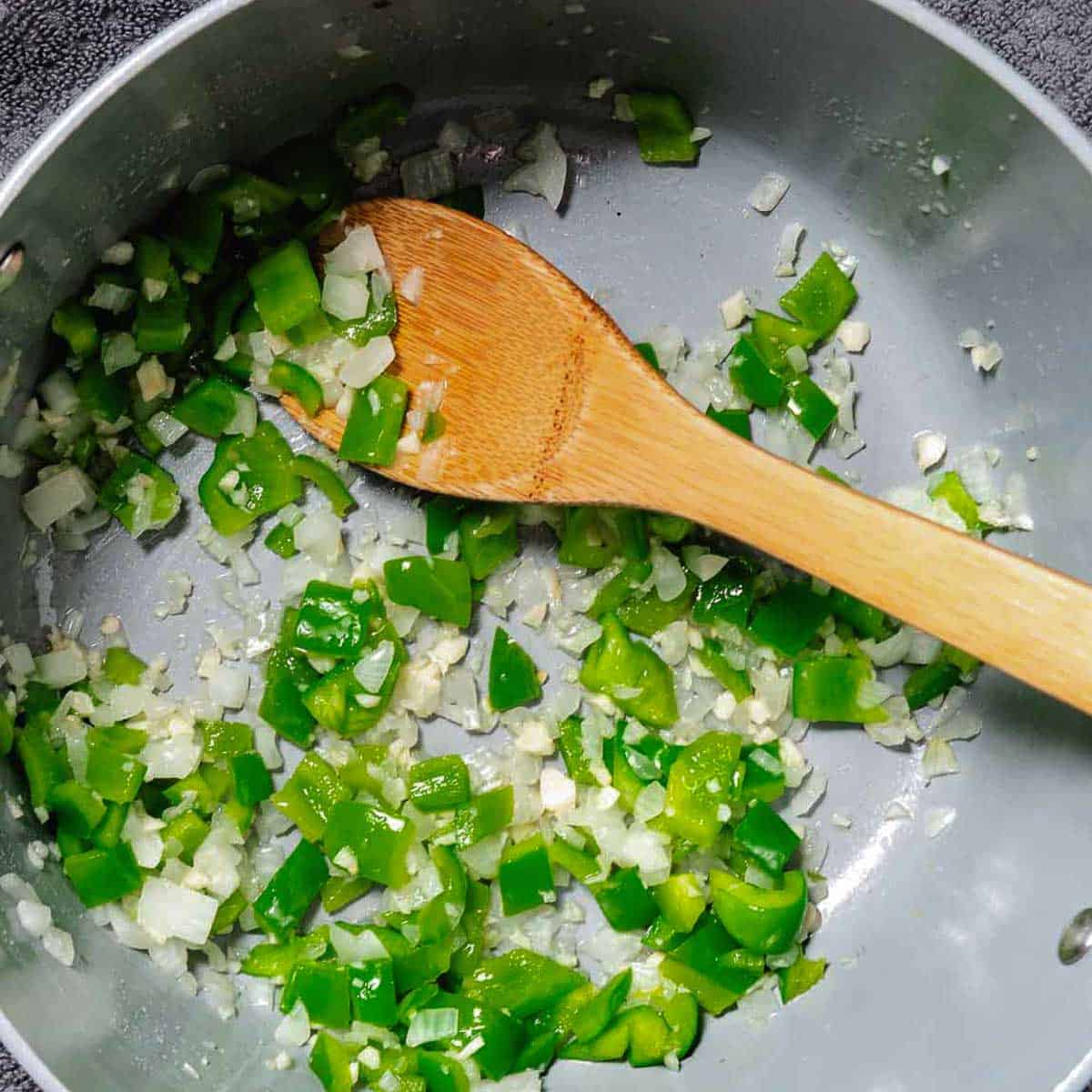 Sautéing onions and green bell peppers 