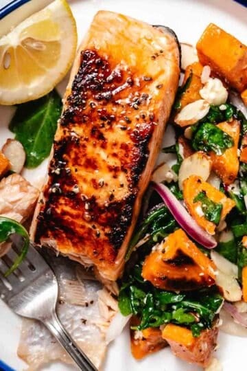 seared salmon over arugula sweet potato salad